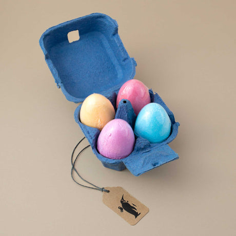 blue-cardboard-egg-box-with-four-colored-bath-bomb-eggs-blue-red-purple-yellow
