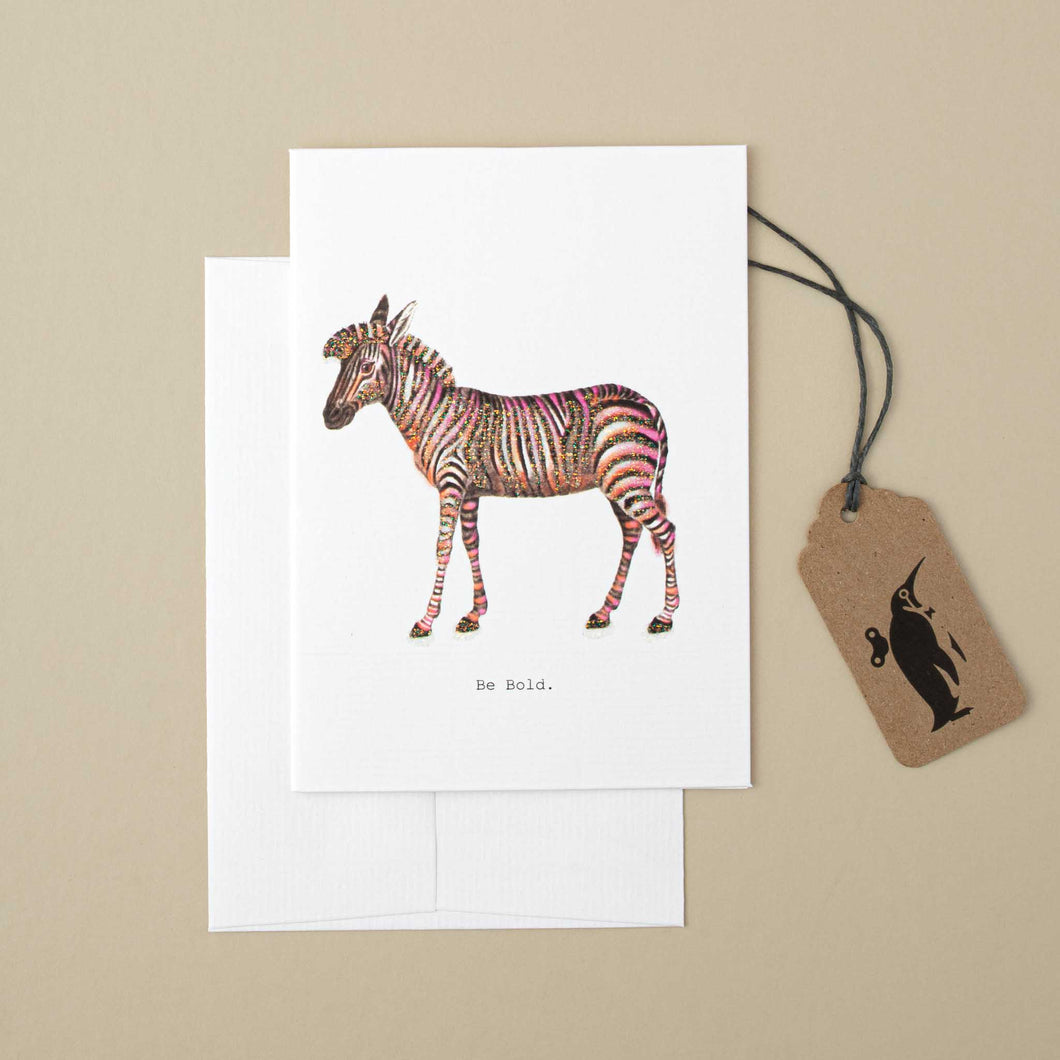 white-card-illustrated-zebra-with-pink-accents-and-black-text-reading-be-bold