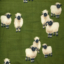 Load image into Gallery viewer, detail-of-dark-green-muslin-fabric-with-valais-sheep-pattern