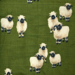 detail-of-dark-green-muslin-fabric-with-valais-sheep-pattern