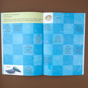 open-book-showing-the-pop-goes-the-pufferfish-boardgame
