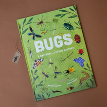 Load image into Gallery viewer,  bugs-a-skittery-jittery-history-book-green-cover-with-various-bugs-spiders-beetles-butterflies-slugs-ants