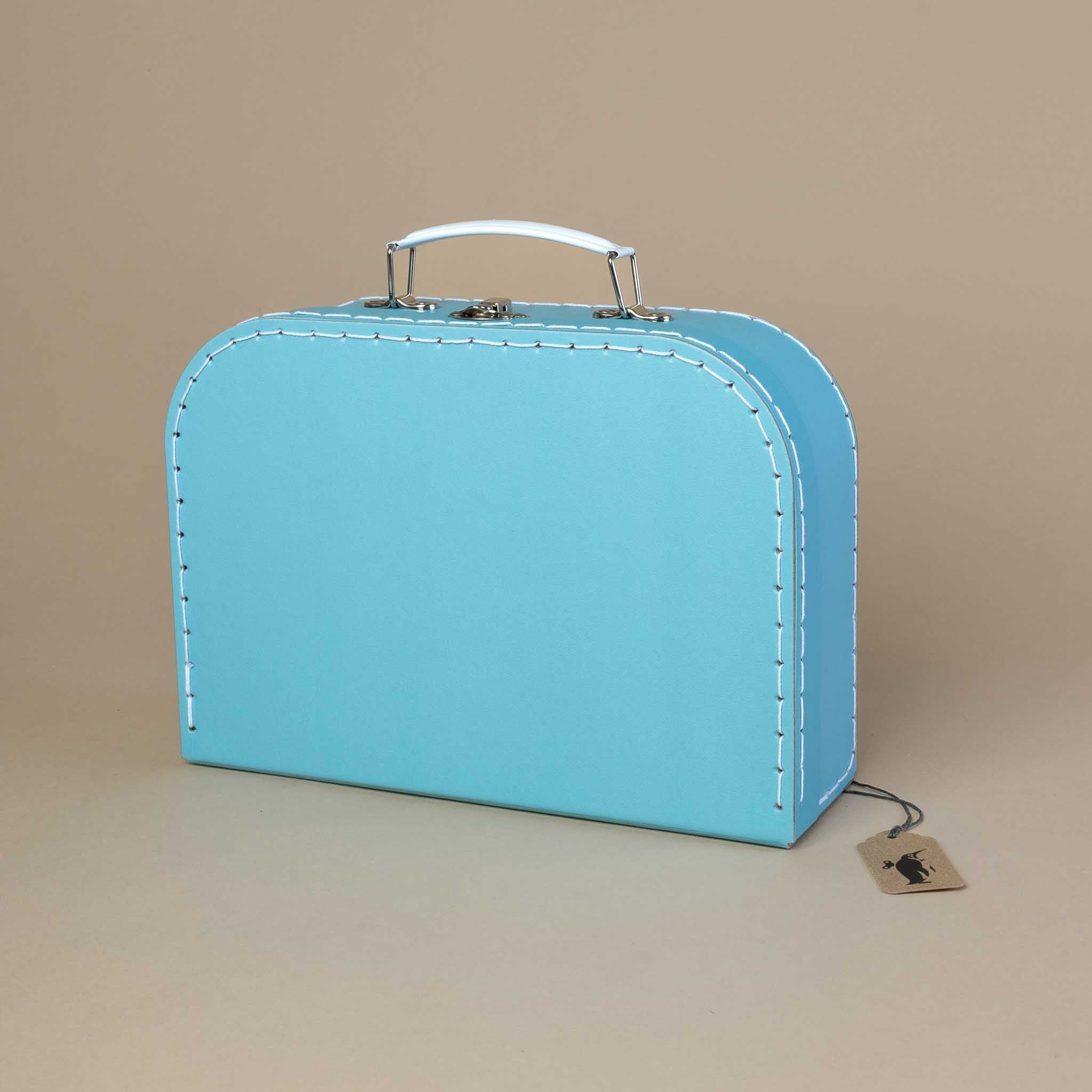 celadon-blue-suitcase-with-white-stiching-and-metal-handle