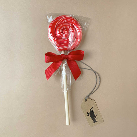 red-with-skinny-white-swirl-lollipop-on-white-stick-tied-with-red-ribbon