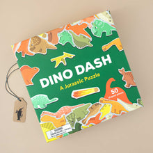 Load image into Gallery viewer, dino-dash-50-piece-puzzle-in-green-box