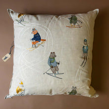 Load image into Gallery viewer, downhill-woodland-animial-skiers-pillow-on-oatmeal-linen-fabric-with-white-snowtrack