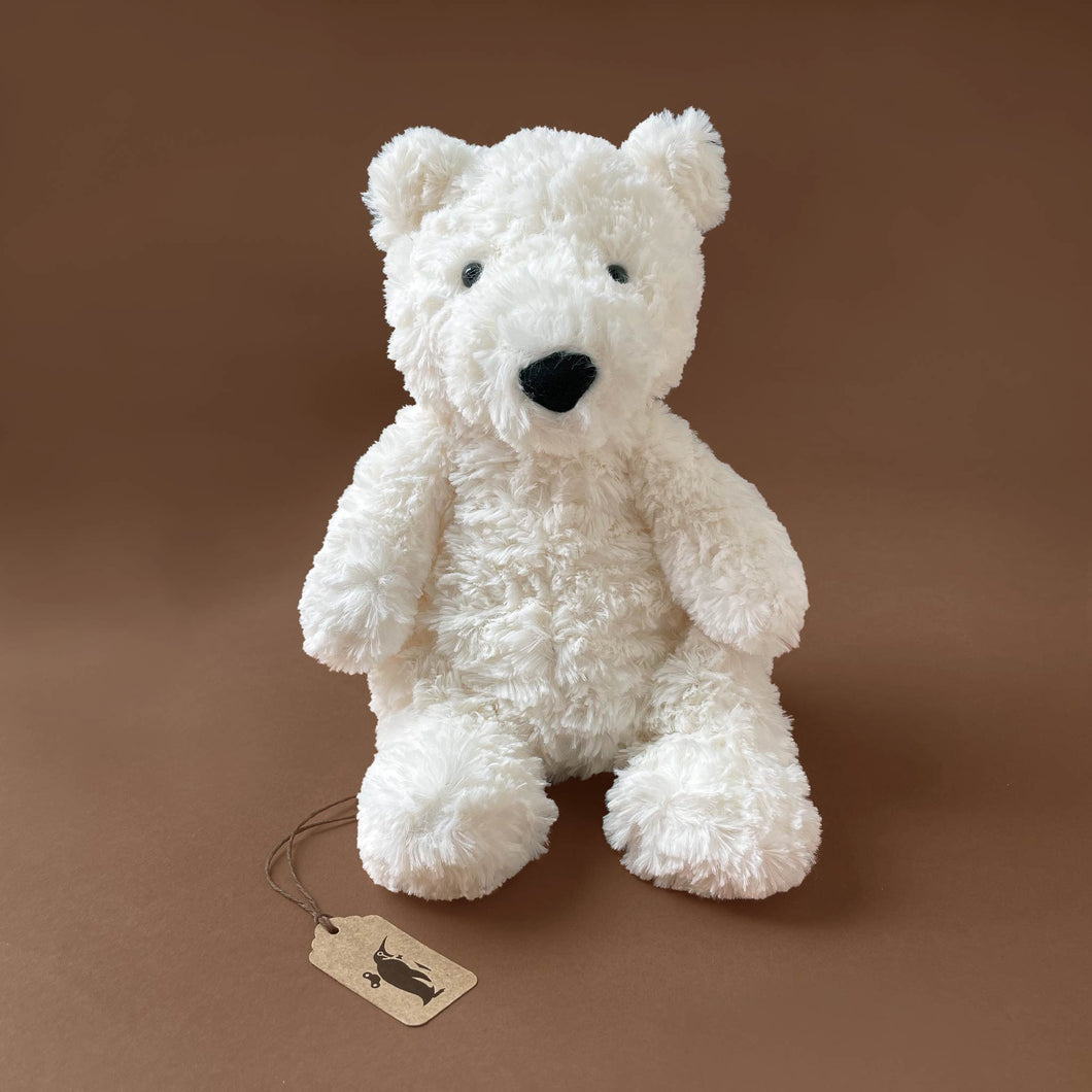 white-stuffed-animal-polar-bear-sitting-up