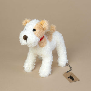 small-brown-and-white-stuffed-dog-with-red-collar