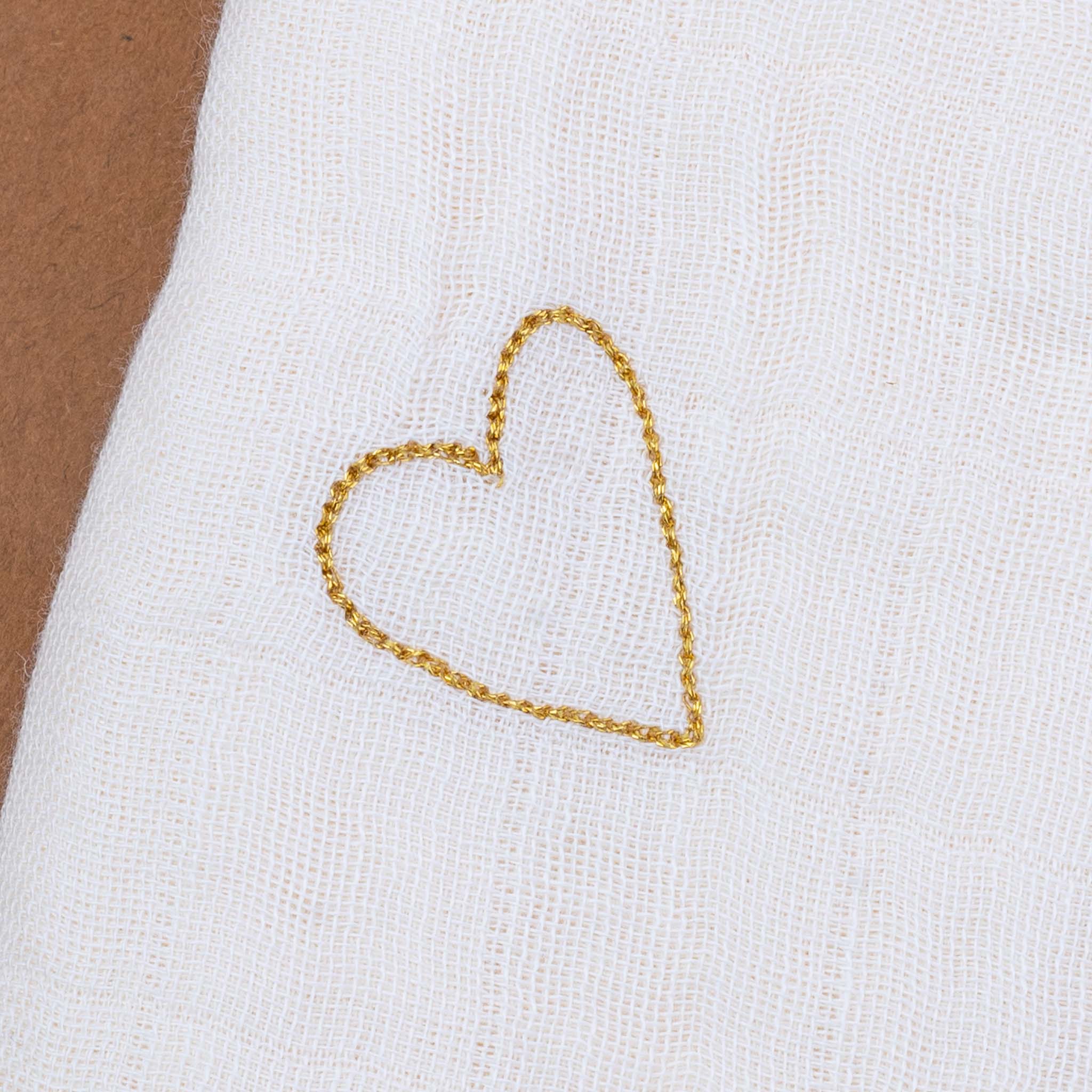 close-up-of-gold-embroidered-heart