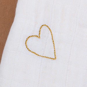 close-up-of-gold-embroidered-heart