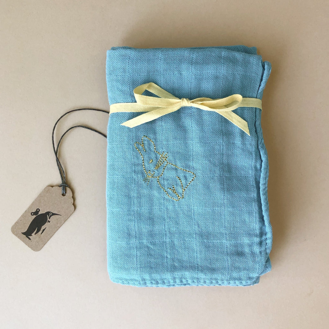 blue-folded-muslin-square-with-yellow-rabbit