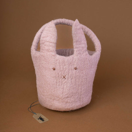felted-round-basket-with-handle-in-lavender-color-and-a-bunny-face-embroidery-on-the-front