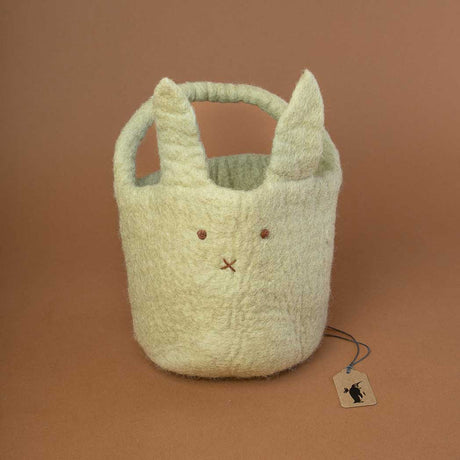 sage-green-basket-with-handle-and-embroidered-face-in-the-front-and-long-standing-ears
