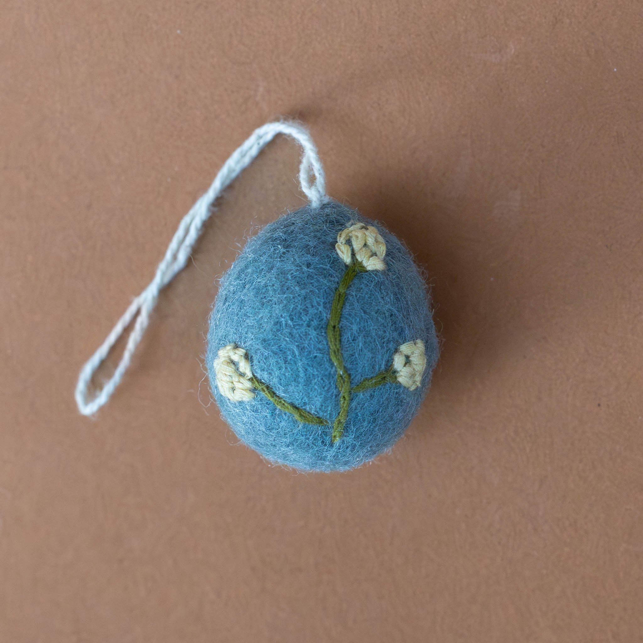 felt-embroidered-yellow-flower-egg-ornament-heather---sea-blue