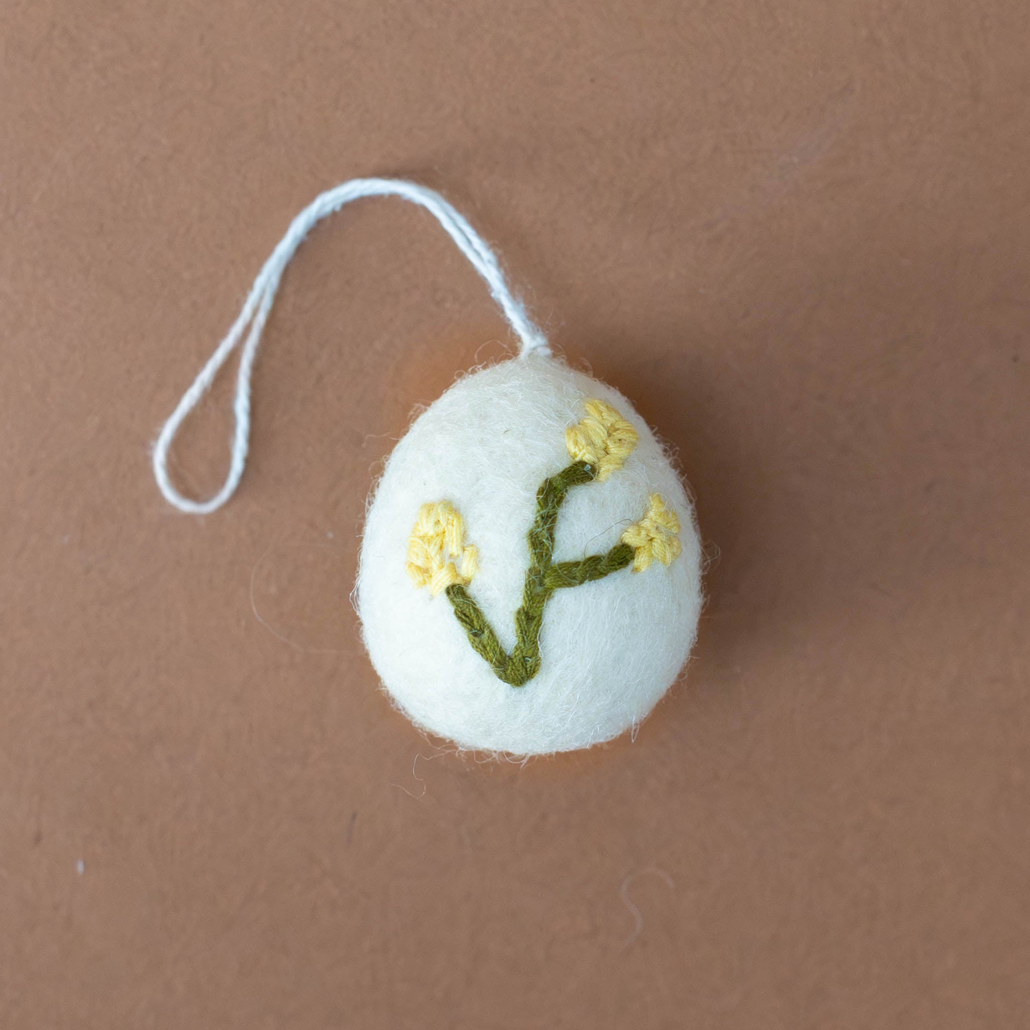 felt-embroidered-yellow-flower-egg-ornament-heather-white