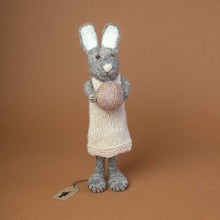 Load image into Gallery viewer, big-grey-rabbit-with-knitted-beige-dress-holding-a-lavender-colored-easter=egg