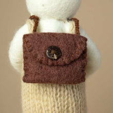 Load image into Gallery viewer, detail-of-backside-showing-a-brown-felted-backpack-closed-with-a-dark-brown-button
