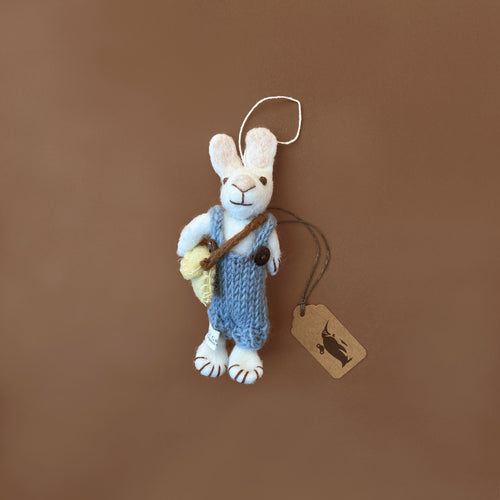 felted-white-rabbit-ornament-wearing-blue-overalls-with-yellow-bag