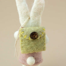 Load image into Gallery viewer, backside-of0bunny-showing-detail-of-sage-green-backpack-closed-with-a-brown-wooden-button