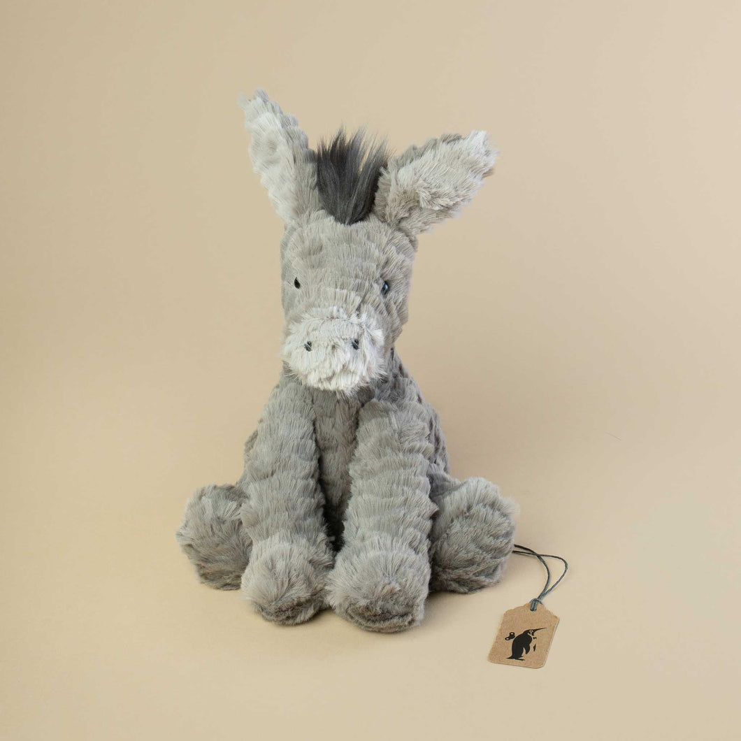grey-fluffy-sitting-donkey-with-long-ears
