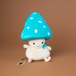 beige-friendly-fungi-with-big-turquoise-hat-with-white-dots