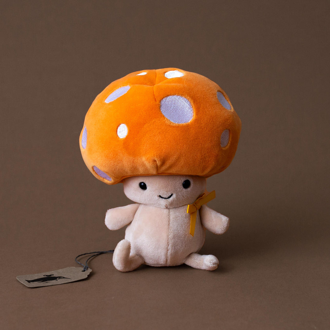 mushroom-stuffed-animal-with-smiling-face-and-orange-spotted-cap