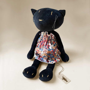 black-cat-plush-wearing-second-dress-blue-and-red-floral