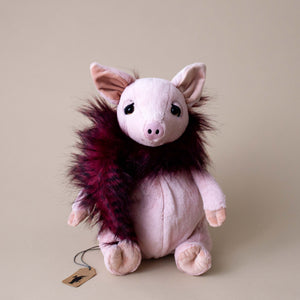 pig-stiffed-animal-wearing-maroon-feather-boa