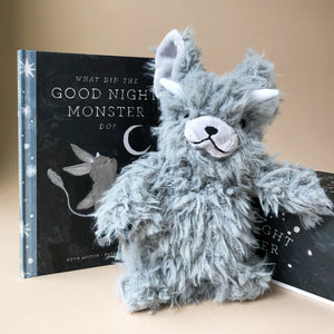 good-night-monster-grey-stuffed-animal-next-to-his-accompanying-book