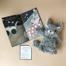 Load image into Gallery viewer, good-night-monster-grey-stuffed-animal-with-horns-and-card-detailing-monster-care-and-interior-page-of-book