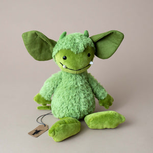 green-gremlin-stuffed-animal-large-ears-and-two-visible-white-fangs