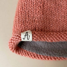 Load image into Gallery viewer, close-up-of-hand-knit-hunter-hat-label