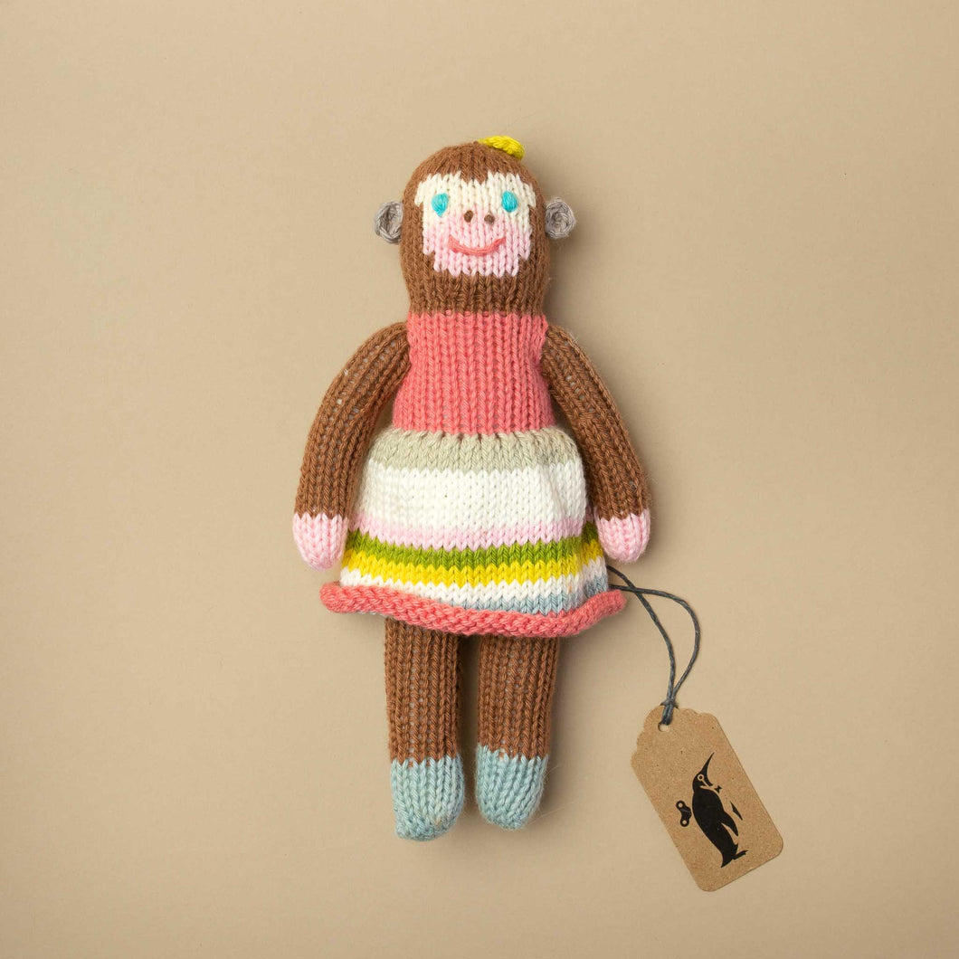 hand-knit-ratte-in-brown-monkey-shape-wearing-a-pink-striped-dress