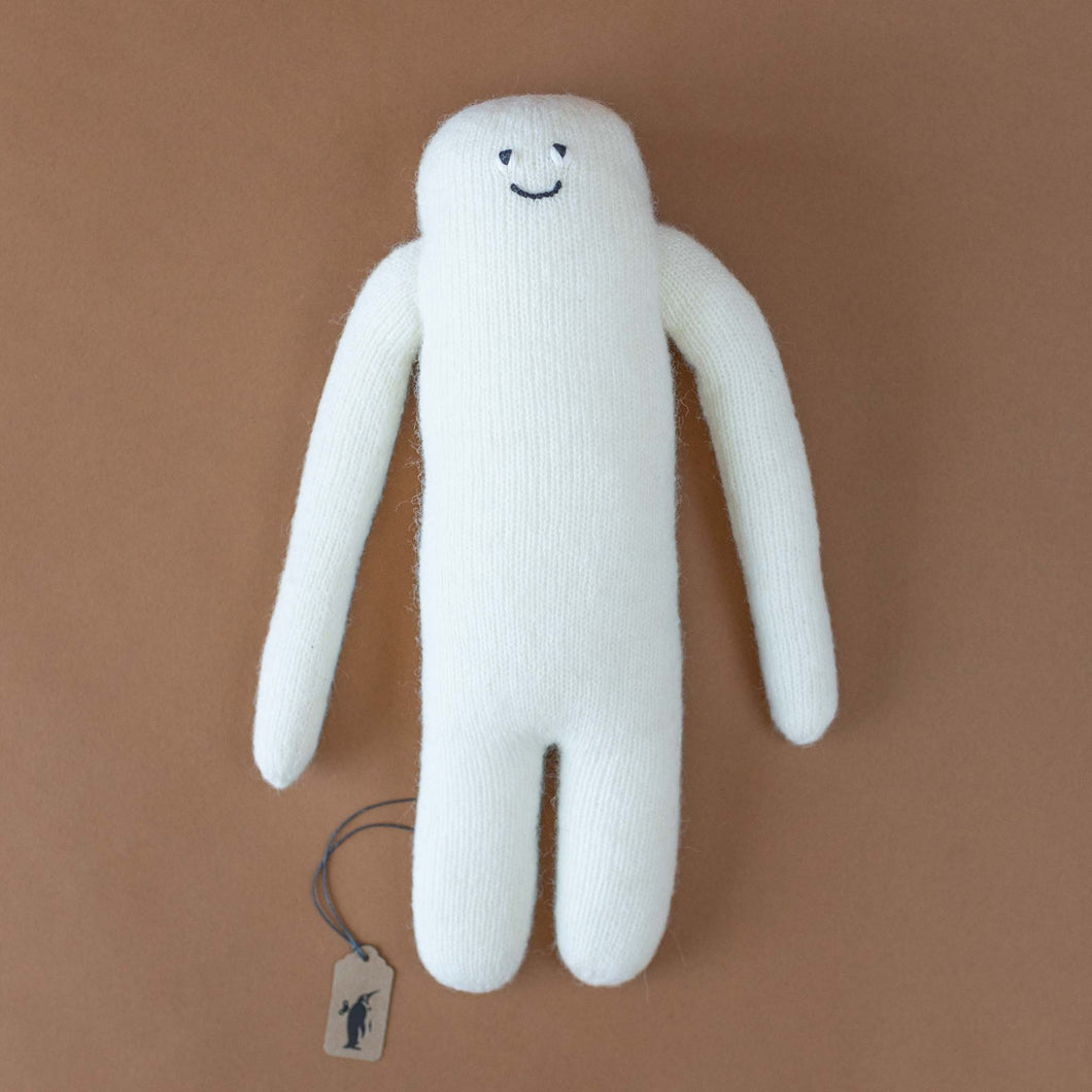 long-white-knit-creature-with-simple-eyes-and-smile