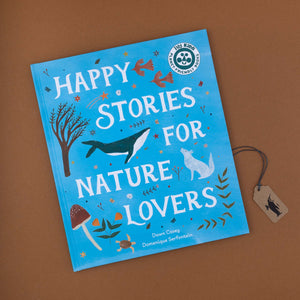 blue-book-cover-with-illustrated-plants-and-animals