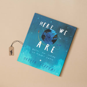 Here-We-Are-Book-by-oliver-Jeffers-front-cover-illustrated-with-planet-earth