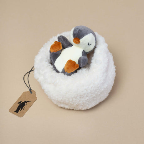 small-penguin-plush-in-white-plush-nest