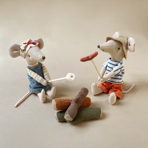 mice-holding-skewers-above-fabric-logs