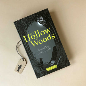 hollow-woods-storytelling-game-in-black-box-with-haunted-woods-illustration