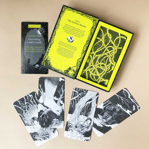 hollow-woods-storytelling-game-open-box-with-instruction-booklet-and-black-and-white-illustrated-cards