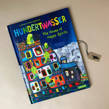 Load image into Gallery viewer, hundertwasser-the-house-of-happy-spirits-book-cover-of-the-night-sky-with-houses-by-Géraldine-Elschner