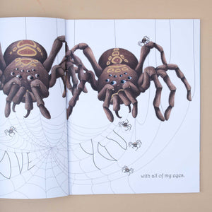 open-book-showing-two-huge-spiders-and-tiny-ones