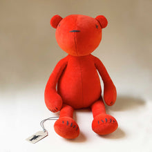 Load image into Gallery viewer, orange-plush-bear-with-embroidered-details-and-cross-eyes