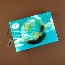 Load image into Gallery viewer, john-derian-paper-goods-planet-earth-1000-piece-puzzle-box-with-globe-floating-in-starry-sky