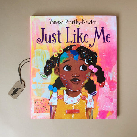 just-like-me-hardcover-picture-book-cover-illustrated-with-african-american-girl-on-a-pink-background