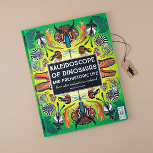 book-cover-in-green-with-dinosaurs-and-ferm-arranged-in-a-mandala