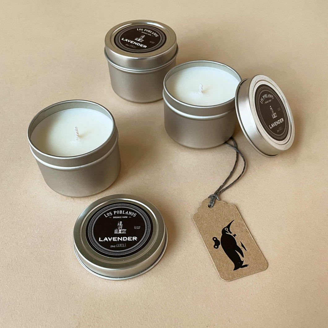three-small-lavender-travel-size-candles-in-metal-tins