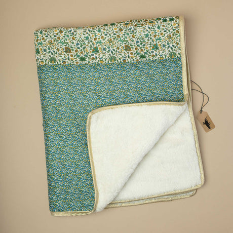 two unique and timeless Liberty fabrics inbaby-blanket-with-blue-floral-and-yellow-and-green-prints-lined-with-polar-fleece