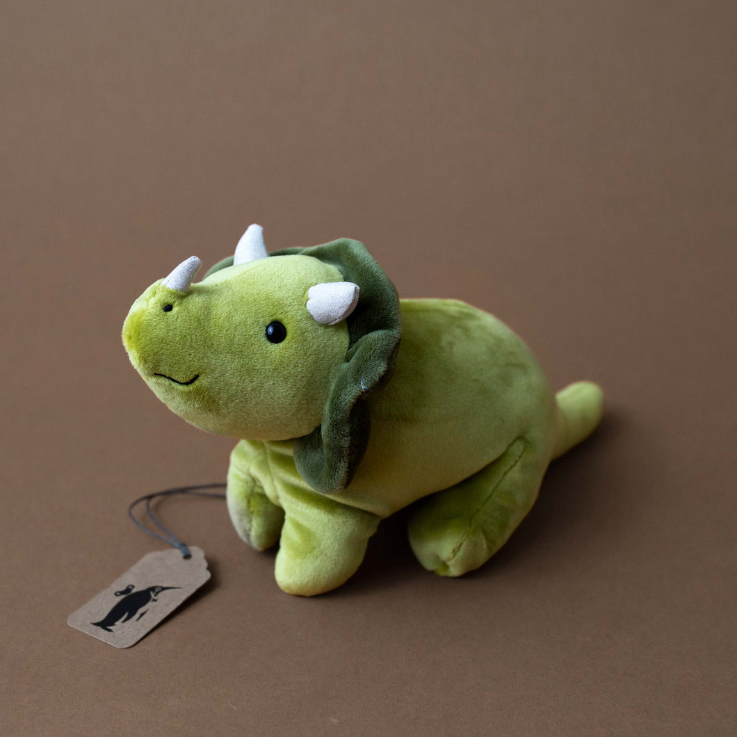 green-triceratops-stuffed-animal-with-white-horns-and-smile