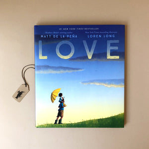 love-book-front-cover-child-on-parents-shoulders-holding-an-umbrella